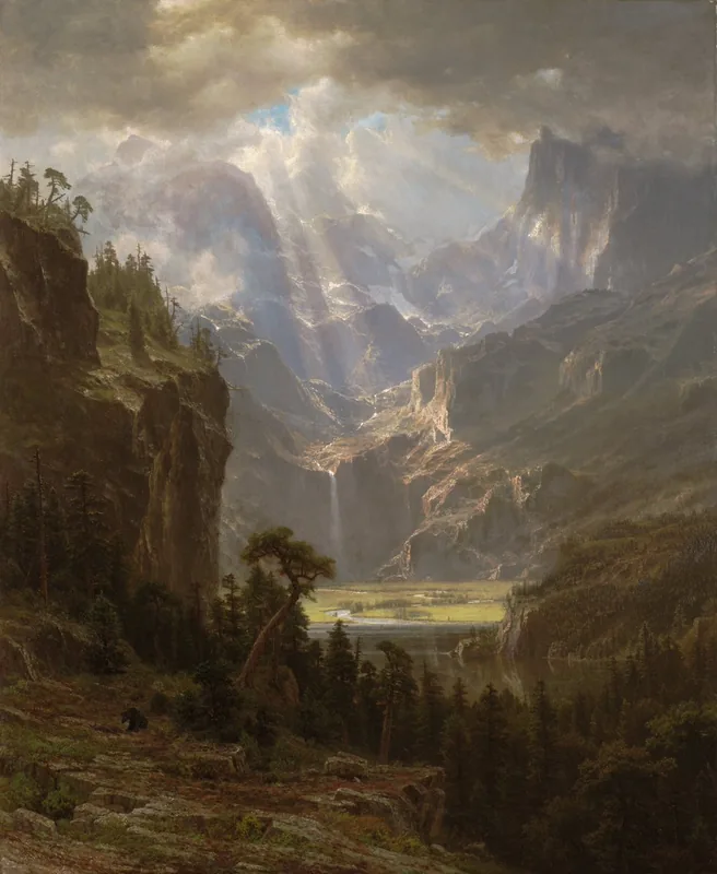 A tall valley of rocky peaks at sunrise, sunbeams breaking through storm clouds onto a green valley floor with a distant waterfall and lake, dark pines in the foreground