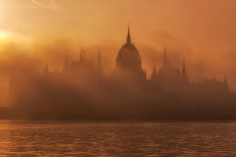 Hungarian Parliament in fog at sunrise