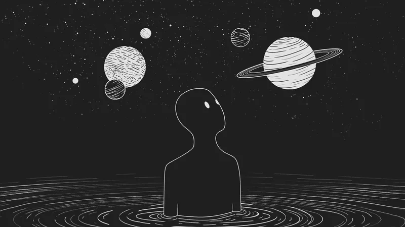 Silhouette figure in ripples looking up at planets