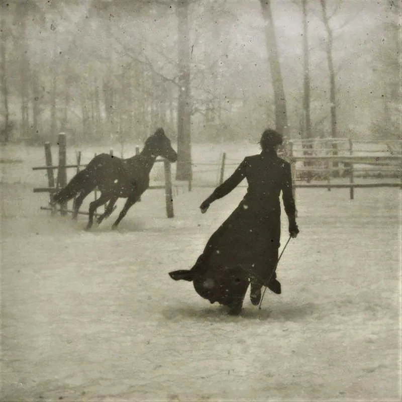 A figure and a horse in deep snow beside a wooden fence, photograph by Félix Thiollier